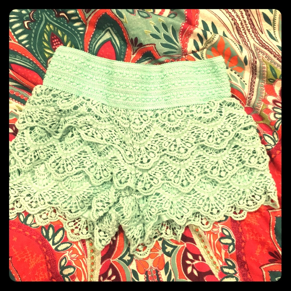 Juniors mint colored ruffled shorts